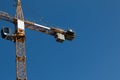 Building. Close-up of a construction crane against the blue sky Royalty Free Stock Photo