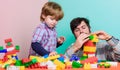 Building with colorful constructor. love. child development. father and son play game. small boy with dad playing