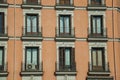 Building with colorful facade and glazed windows in Madrid
