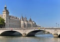 Building of the Conciergerie in Paris and Pont Neuf bridge Royalty Free Stock Photo