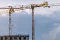 Building constraction site with 2 yellow cranes. Growth concept. Copy space for text Royalty Free Stock Photo