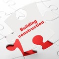 Building construction concept: Building Construction on puzzle background Royalty Free Stock Photo