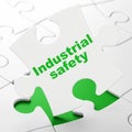 Building construction concept: Industrial Safety on puzzle background Royalty Free Stock Photo