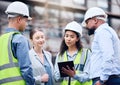 Building, construction and group with architect on tablet, project blueprint or engineering planning for work site Royalty Free Stock Photo