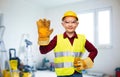 boy in protective helmet, gloves and safety vest Royalty Free Stock Photo