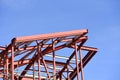 Building construction in progress. Red primer painted steelwork Royalty Free Stock Photo