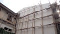 Building, Construction. Scaffolding at construction with wooden bamboo. Scaffold of bamboo.