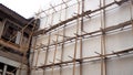 Building, Construction. Scaffolding at construction with wooden bamboo. Scaffold of bamboo.