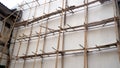 Building, Construction. Scaffolding at construction with wooden bamboo. Scaffold of bamboo.