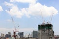 Building construction site with cranes against blue sky, construction Royalty Free Stock Photo