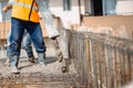 construction site details - building concrete slabs at house construction and pouring cement on reinforcement bars Royalty Free Stock Photo