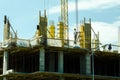 Building construction site with scaffolding and workers. Royalty Free Stock Photo