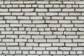 Building construction: white brick  wall texture - stained bricks bonded with cement Royalty Free Stock Photo