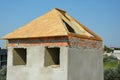 Building construction wooden panel roof on unfhinished house brick chimney Royalty Free Stock Photo