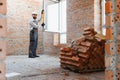 Building construction worker installing window using level tool Royalty Free Stock Photo