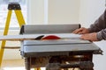 Building contractor worker using circular saw to cut boards on a new home constructiion project Royalty Free Stock Photo