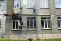 Building contractors are installing, assembling high scaffolding to renovate the facade of the building Royalty Free Stock Photo