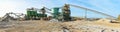 Building and conveyor system in a gravel pit - open-cast mine for sand and gravel Royalty Free Stock Photo