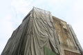 Building covered by black canvas and under construction Royalty Free Stock Photo