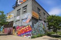 Building covered with murals and graffiti in Williamsburg section in Brooklyn