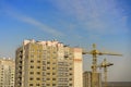 Building crane and building under construction against blue sky Royalty Free Stock Photo