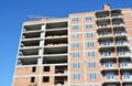 Building crane and building under construction with red brick walls Royalty Free Stock Photo