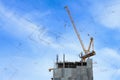 Building crane and construction site under blue sky with drawing Royalty Free Stock Photo