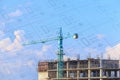 Building crane and construction site under blue sky with drawing Royalty Free Stock Photo