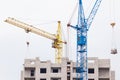 Building crane under construction against blue sky Royalty Free Stock Photo