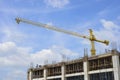 Building crane and building under construction against blue sky Royalty Free Stock Photo