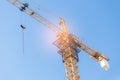 Building crane  under construction against blue sky Royalty Free Stock Photo