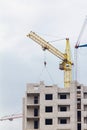 Building crane under construction against blue sky Royalty Free Stock Photo