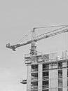 Building crane under construction site Royalty Free Stock Photo