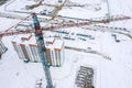 Building crane on winter construction site. aerial photo with drone Royalty Free Stock Photo