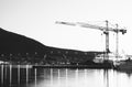 Building cranes in evening Tromso Royalty Free Stock Photo