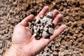 Building crushed stone with sand in hand Royalty Free Stock Photo