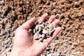 Building crushed stone with sand in hand Royalty Free Stock Photo