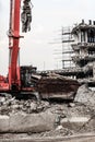 Building demolition by machinery for new construction. Royalty Free Stock Photo