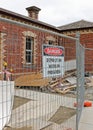 Building demolition site with signage, barricade and rubble Royalty Free Stock Photo