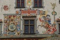 Building detail in Old Tawn Hall in Lindau decorated with ornament paintings and a clock