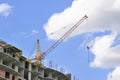Building with elevating crane Royalty Free Stock Photo