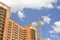 Building with elevating crane Royalty Free Stock Photo
