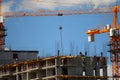 Building with elevating cranes Royalty Free Stock Photo