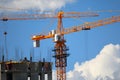 Building with elevating cranes Royalty Free Stock Photo