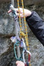 Emergency rescue system with ropes during a wilderness rescue course and a hand pointing and explaining