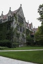 Building in English gothic style and trees Royalty Free Stock Photo