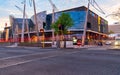 Building example modern architecture glass and steel curving wavy facade in evening light