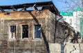 Building exterior of abandoned rustic house. facade of destroyed wooden house.