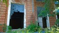 Building exterior with broken windows of old abandoned factory. Crisis. Dirty broken wall. Messy. Systemic economic, industrial Royalty Free Stock Photo