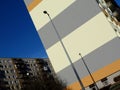 Building exterior facade detail with striped colorful stucco